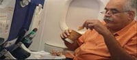 Indigo MD eating Parle-G with tea in flight!!!